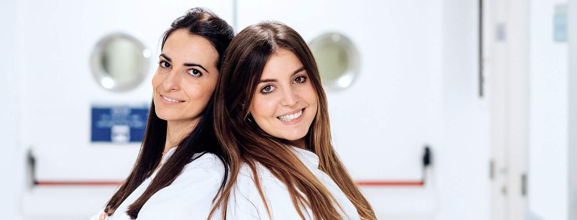 Dental professionals in a bright clinical setting